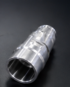 Stepped bore sleeve with relief grooves